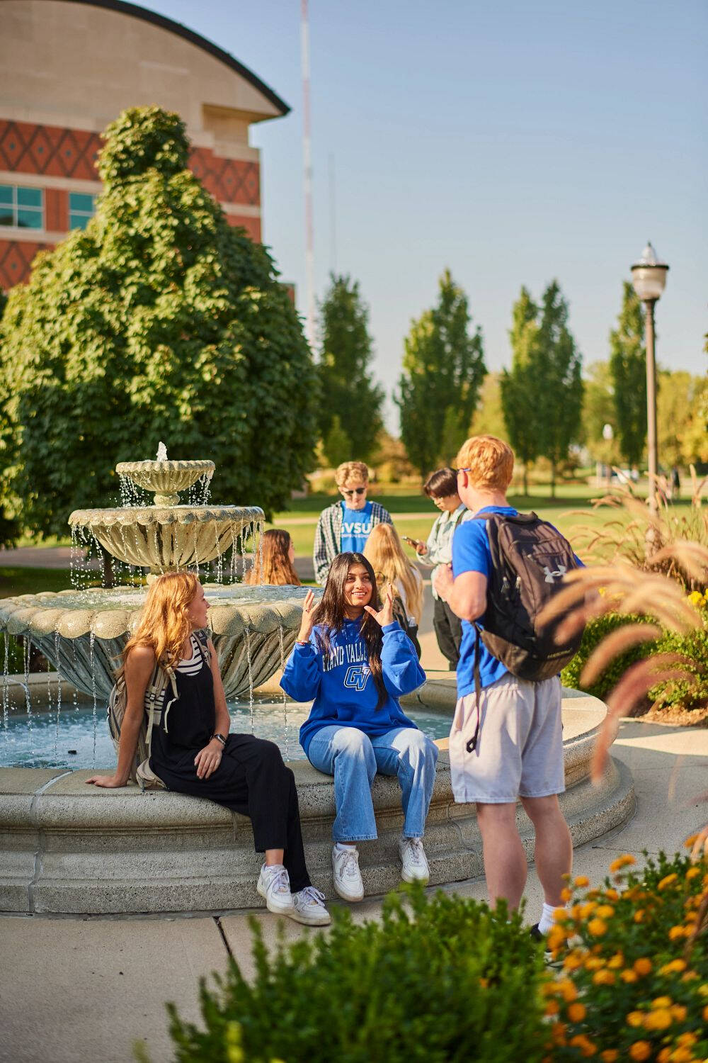 GVSU students on campus at the fountain